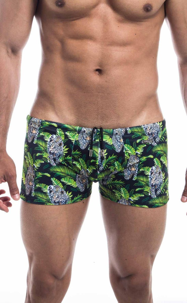 Oceanico square cut green and black swim trunks with vibrant jungle pattern featuring leopards and tropical leaves