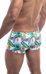 White oceanico square cut swim trunks with vibrant tropical pattern of black and white zebras green palm leaves and flowers