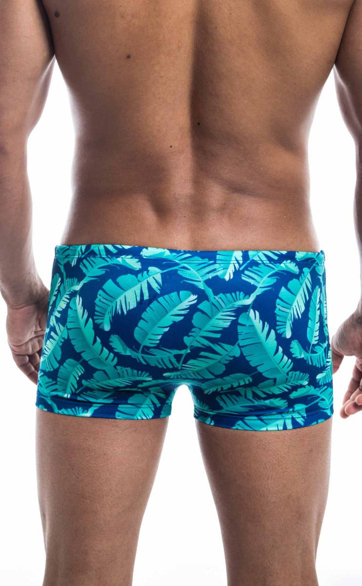 Oceanico square cut swim trunks with vibrant turquoise and deep blue tropical leaf pattern for beachwear