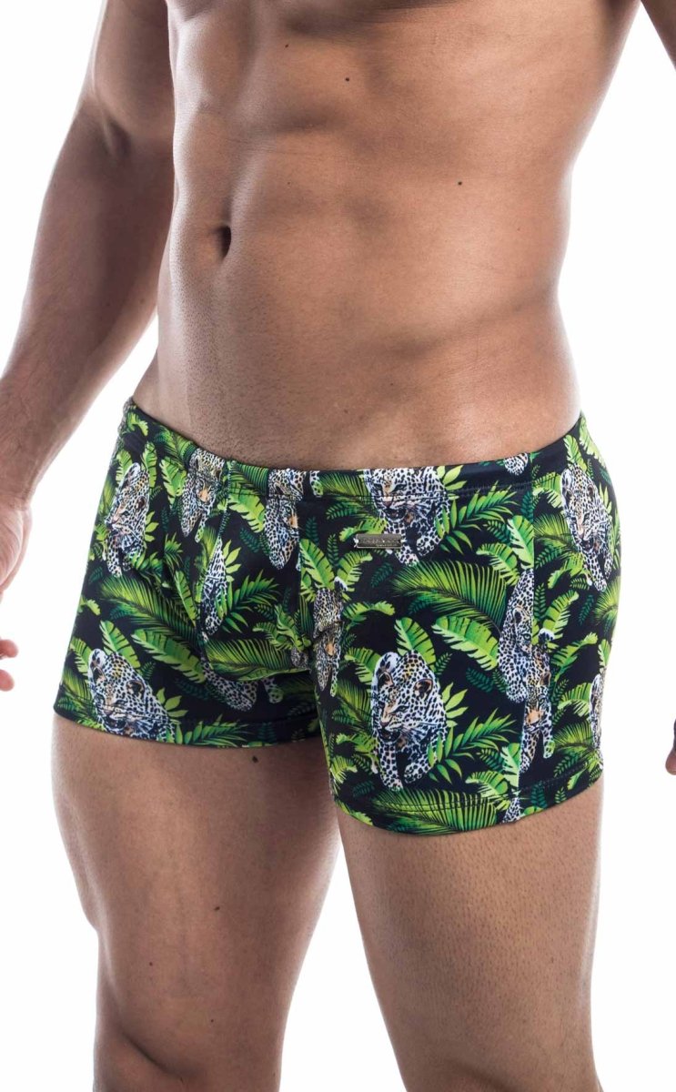 Oceanico square cut men’s swim trunks with vibrant jungle pattern of green foliage and spotted leopards on navy background
