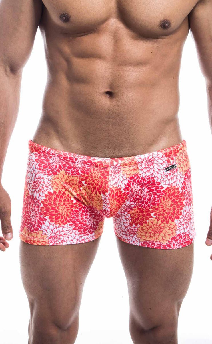 Oceanico square cut vibrant floral-patterned swim trunks in pink red and orange for stylish beachwear