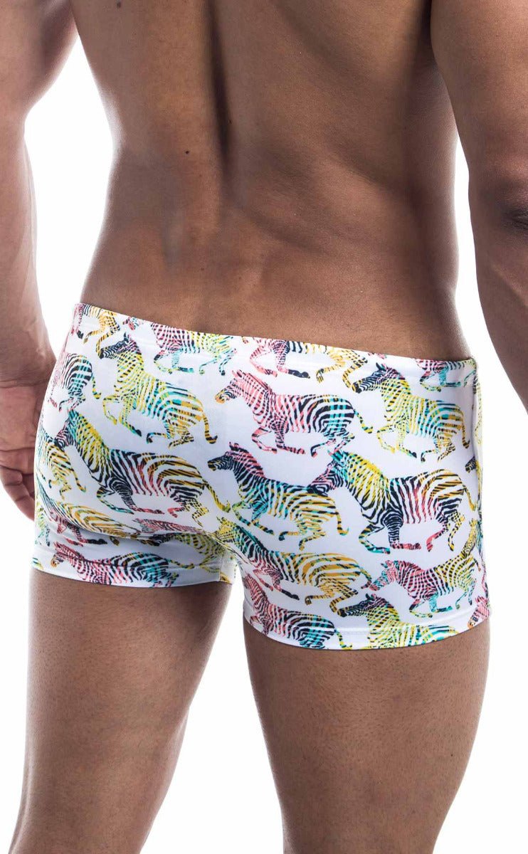 Oceanico Square Cut white swim trunks with vibrant rainbow zebra pattern ideal for beach and poolwear