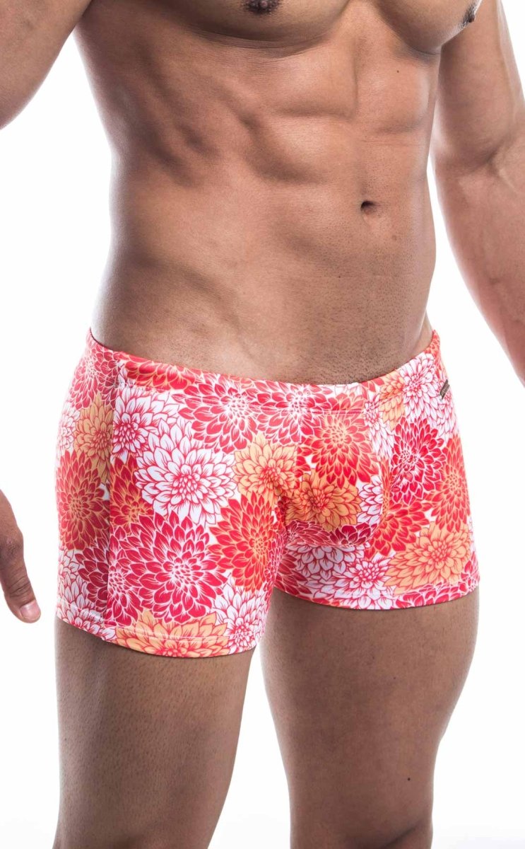 Oceanico square cut swim trunks with vibrant pink red and orange floral pattern designed for beachwear