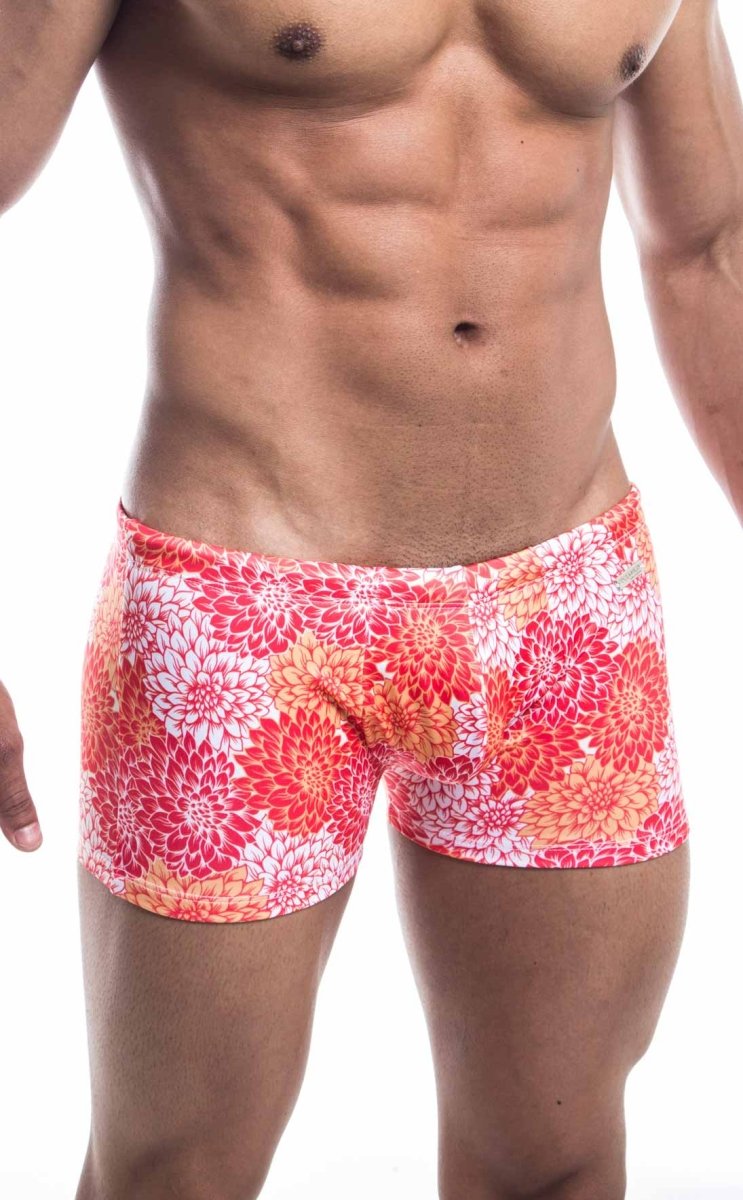 Oceanico square cut vibrant coral and white floral swim trunks with snug form-fitting design for swimming and beachwear
