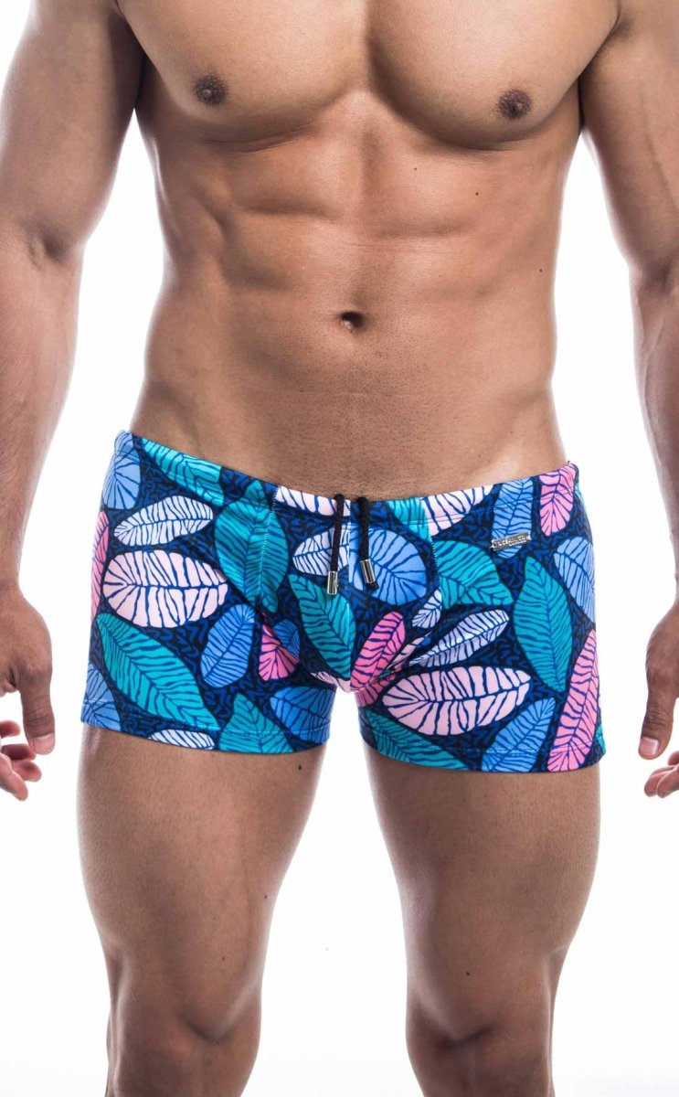 Oceanico square cut swim trunks with blue and pink leaf pattern on dark blue base for beachwear