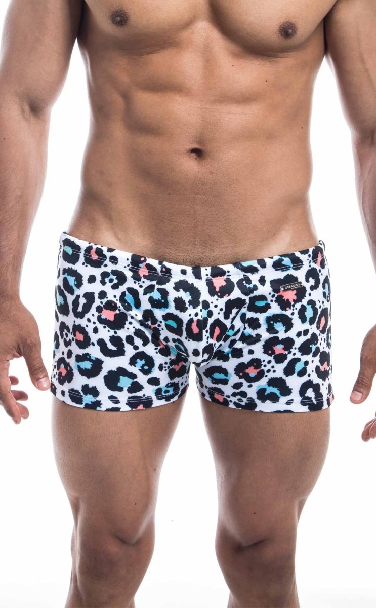 Oceanico square cut white swim trunks with bold leopard print featuring black pink and teal spots