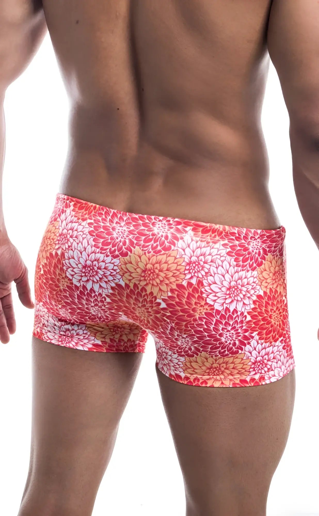 Oceanico square cut high-waisted swim trunks with vibrant coral and white floral pattern for beachwear