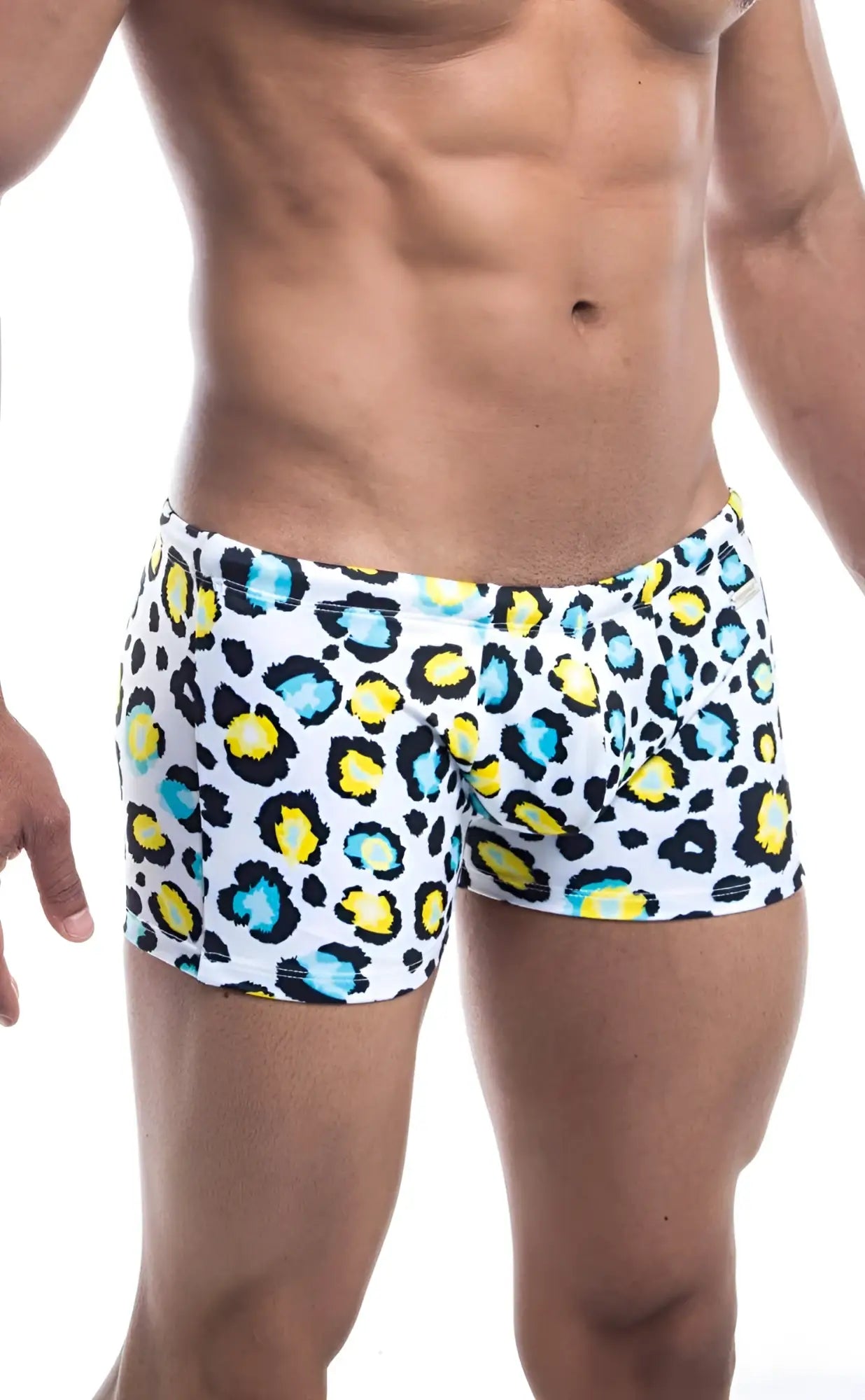 Oceanico square cut white swim trunks with bold leopard print in vibrant yellow and teal accents