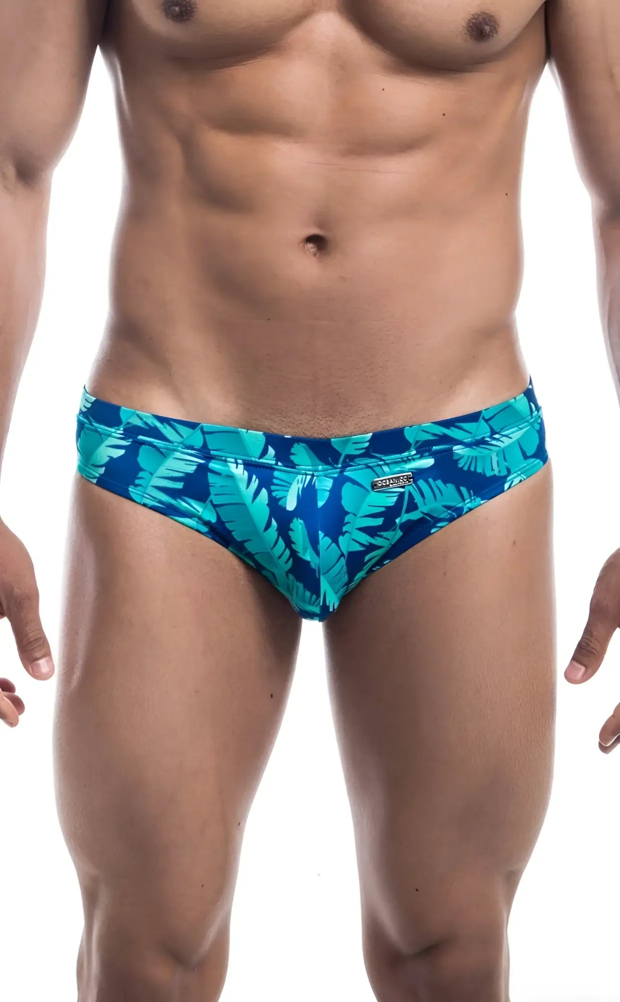 Oceanico swim bikini featuring vibrant turquoise and deep blue tropical leaf-patterned swim trunks