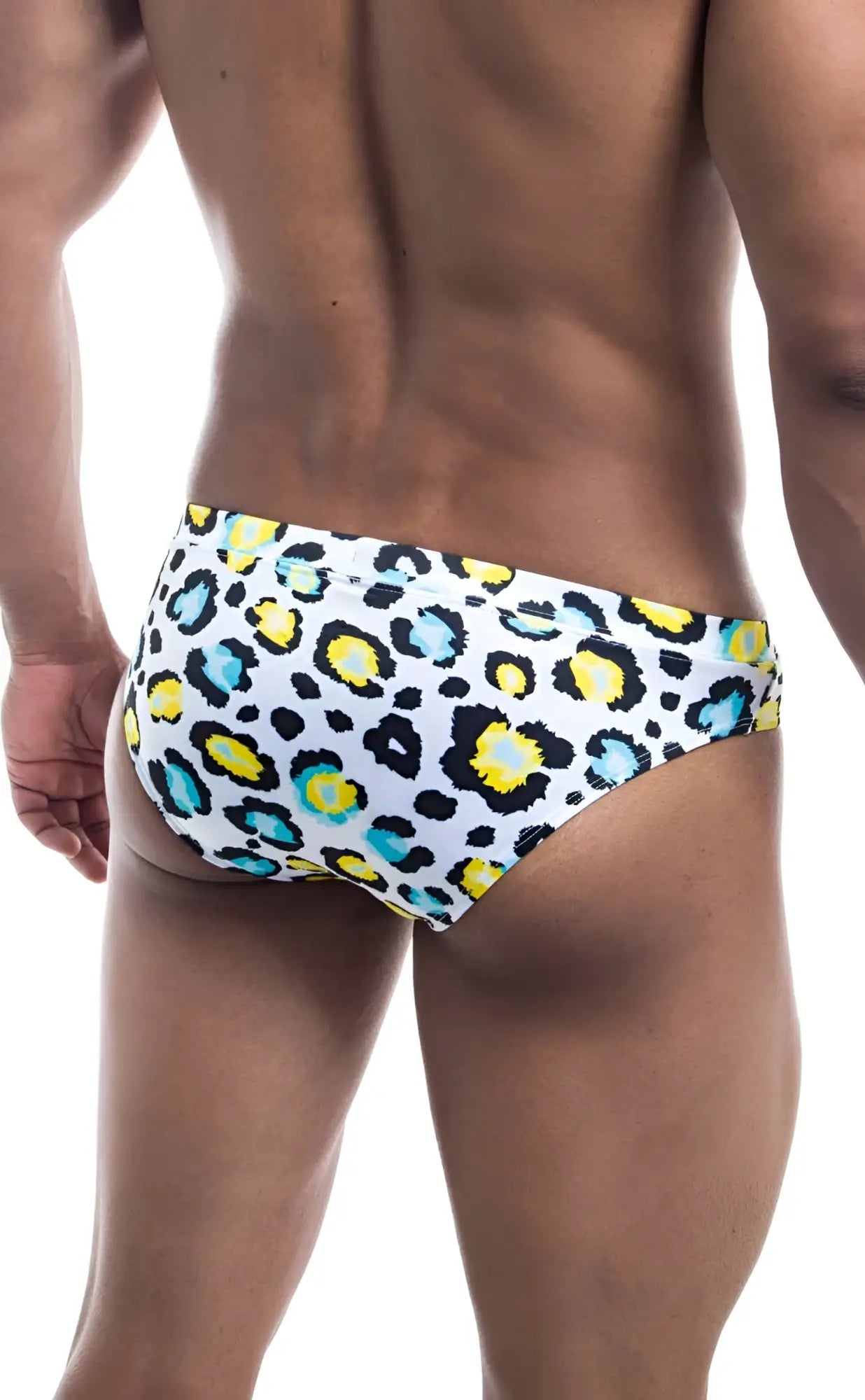 White Oceanico swim trunks with bold colorful leopard print featuring yellow and teal spots for beachwear