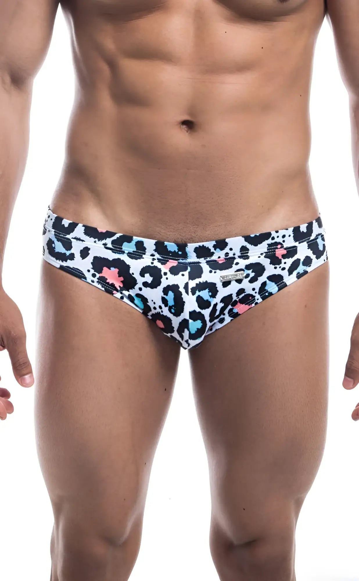 White oceanico swim bikini trunks with bold leopard print black spots and bright blue and pink accents