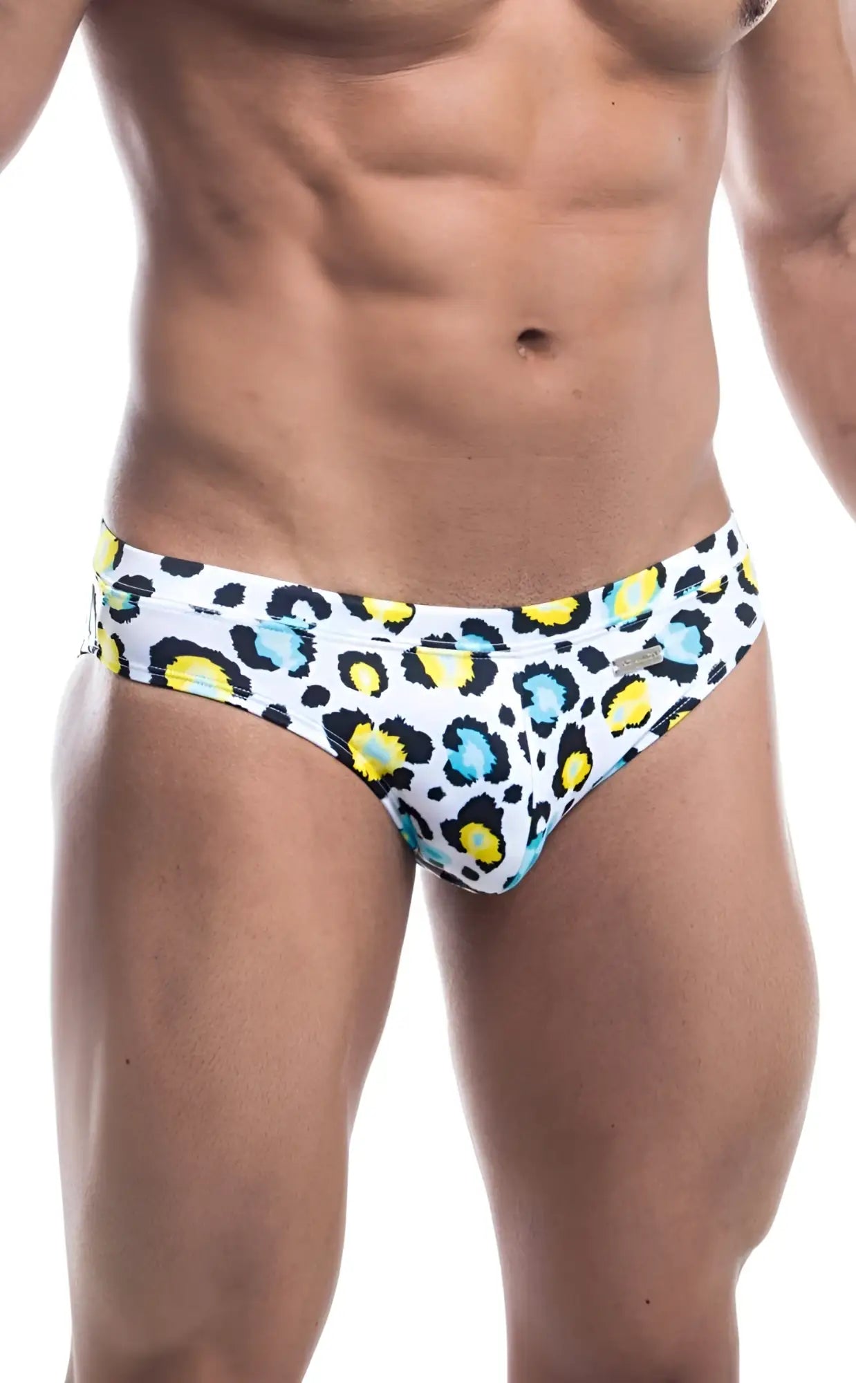 White Oceanico swim trunks with bold leopard print featuring yellow and light blue spots for beachwear