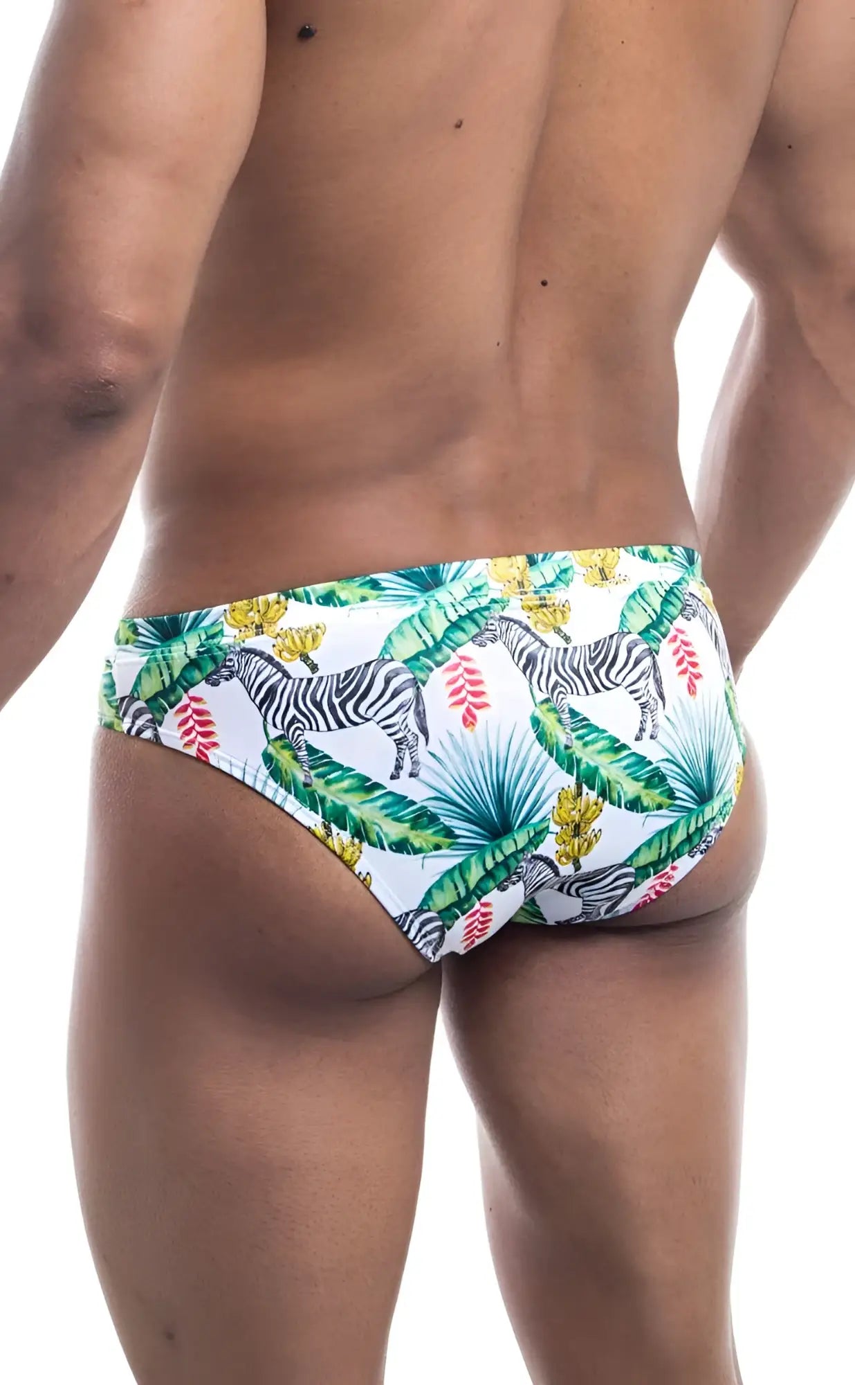 White oceanico swim bikini trunks with vibrant tropical print featuring black and white zebras green palm leaves and pink flowers
