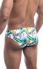 White oceanico swim bikini trunks with vibrant tropical print featuring black and white zebras green palm leaves and pink flowers