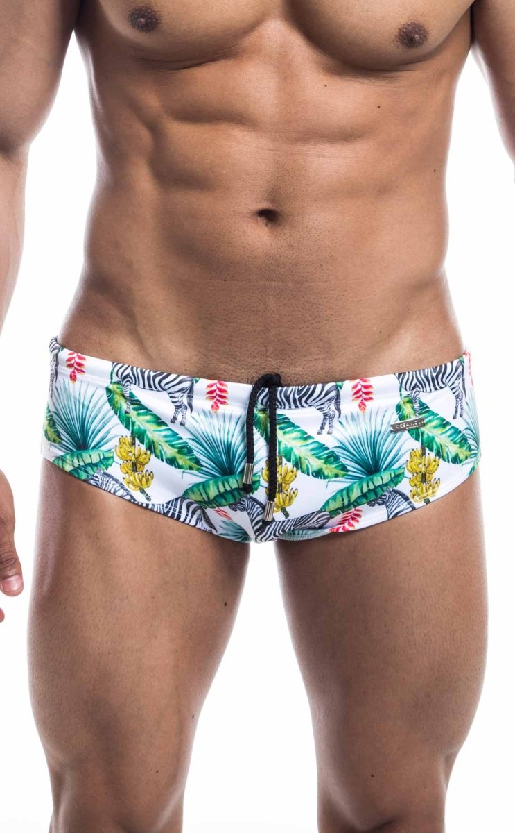 Oceanico swim brief white swim trunks with vibrant tropical print green palm leaves yellow flowers and zebras