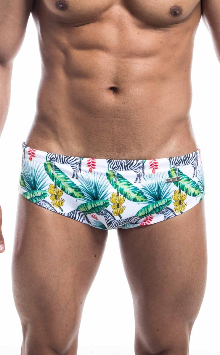 Oceanico swim brief white swim trunks with vibrant tropical palm leaves bananas pink flowers and zebra pattern