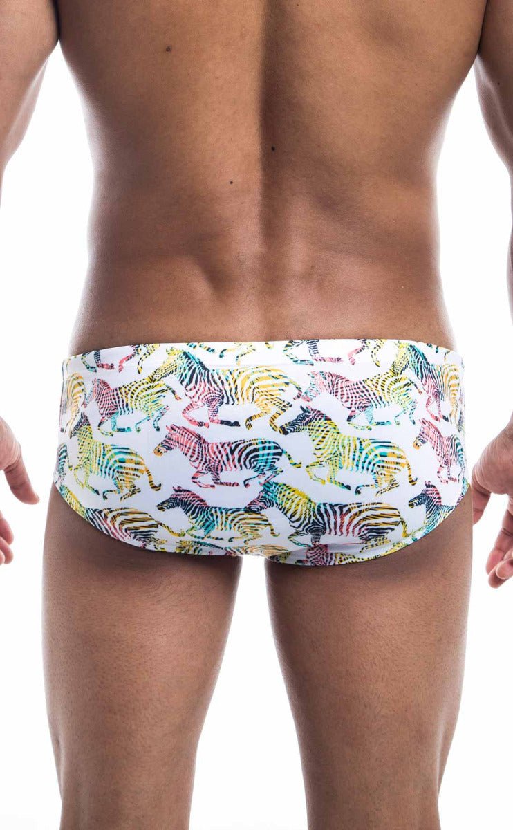 White oceanico swim brief with vibrant rainbow zebra pattern designed for swimwear use