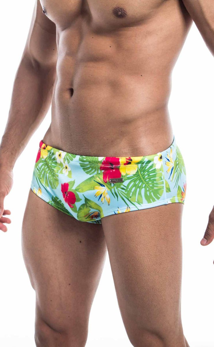 Oceanico swim brief featuring brightly colored tropical print in light blue green red and yellow for beachwear