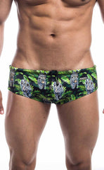 Oceanico swim brief featuring green and black fabric with a vibrant jungle pattern and white-spotted leopards
