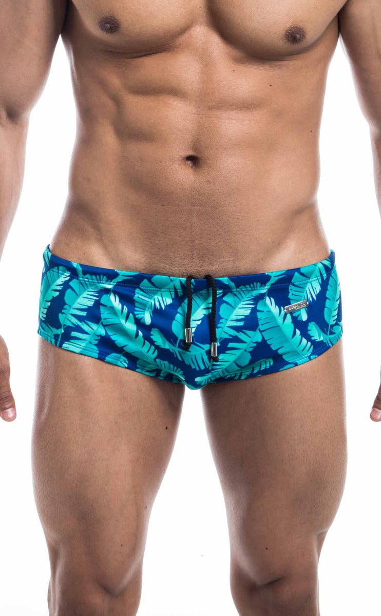 Oceanico swim brief with vibrant turquoise and navy blue tropical leaf pattern and black drawstring waistband