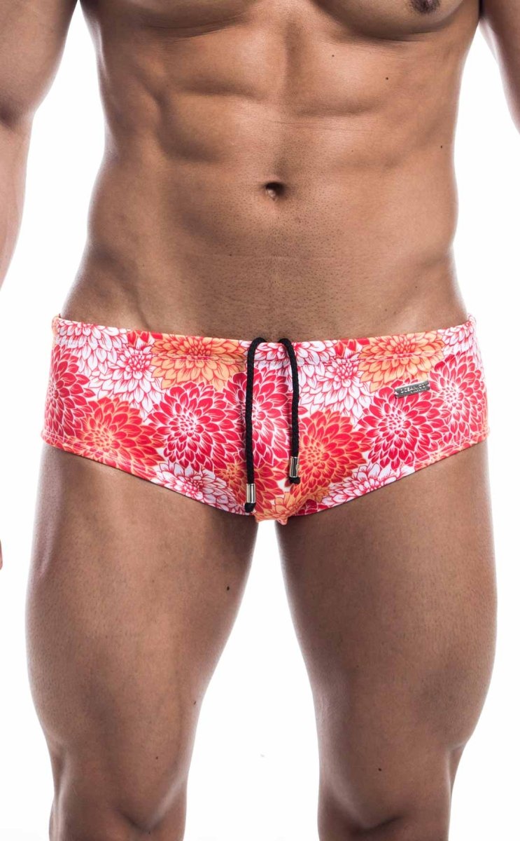 Oceanico swim brief featuring vibrant red and pink floral patterned swim trunks with black drawstring ties