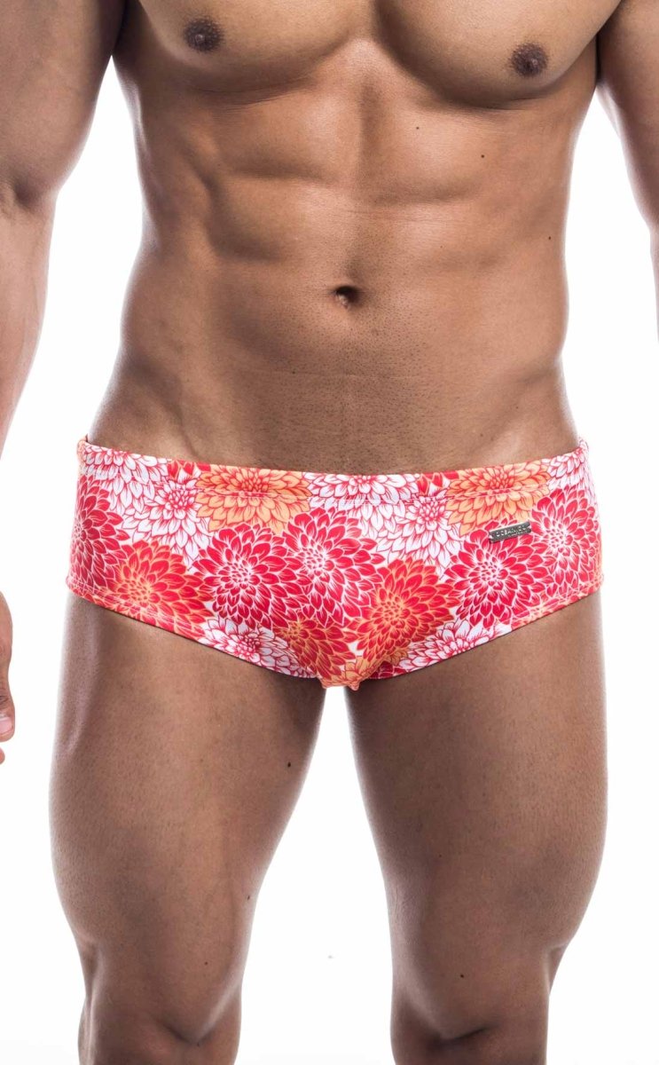 Oceanico swim brief vibrant floral-patterned swim trunks in pink red orange on white base designed for beachwear