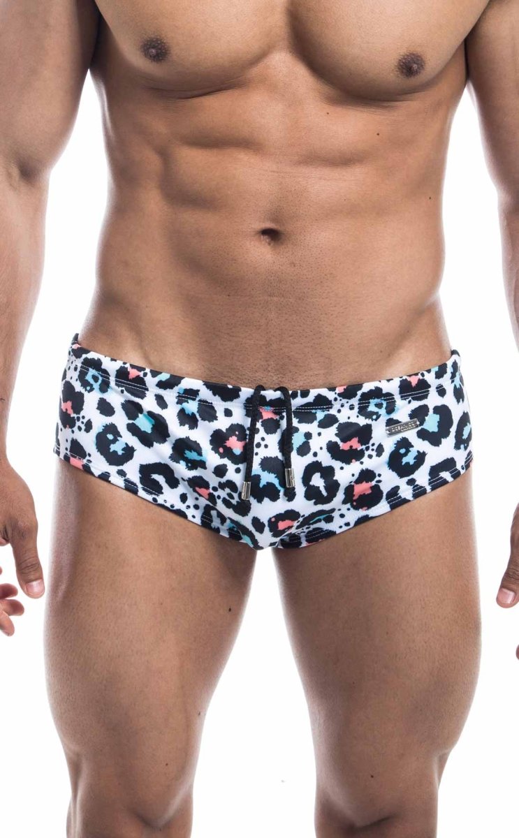 Oceanico swim brief in white swim trunks with bold leopard print black spots and pink light blue accents for stylish swimwear