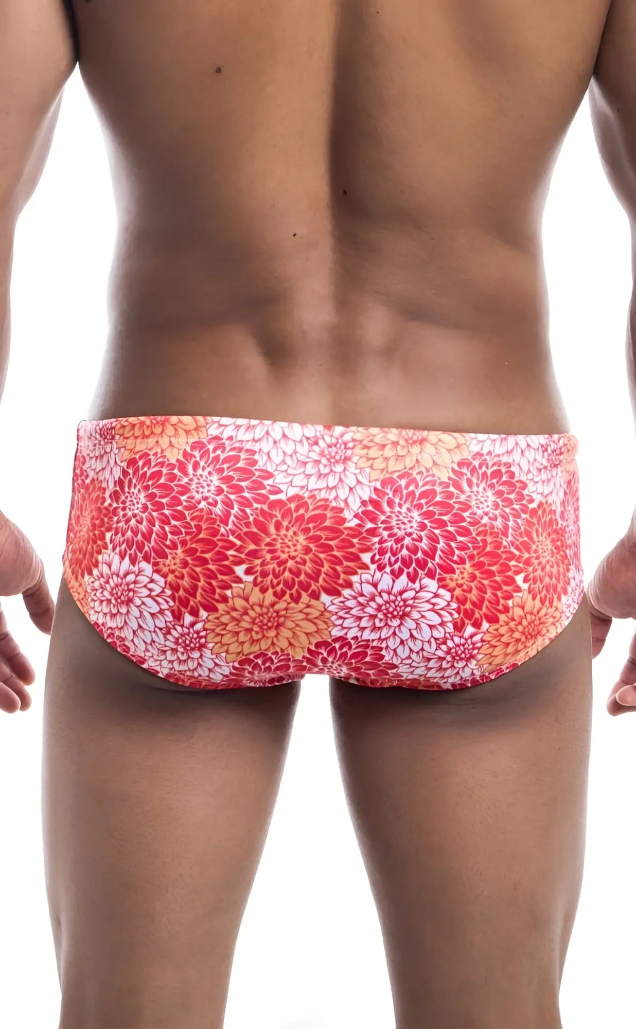 Oceanico swim brief with vibrant red and orange floral-patterned fabric designed for comfortable swimming