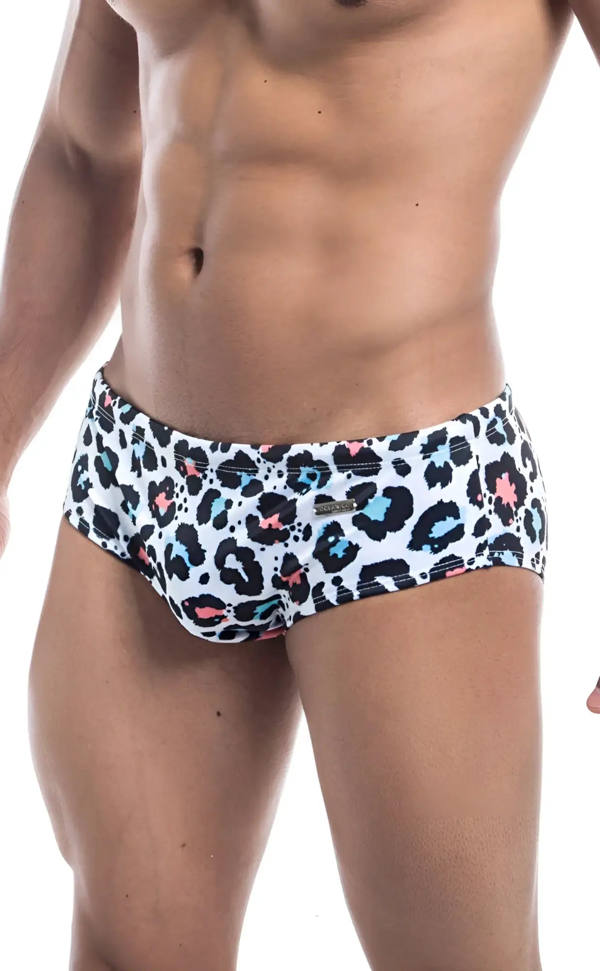 Oceanico swim brief featuring white swim trunks with bold leopard print in black blue and pink spots