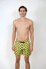 Bright yellow octopus print swim shorts with repeating black pattern perfect for beach and pool use