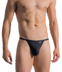 Black form-fitting thong with sleek minimalist design and subtle waistband branding shown from the back by OLAF BENZ 0965 RIOTANGA