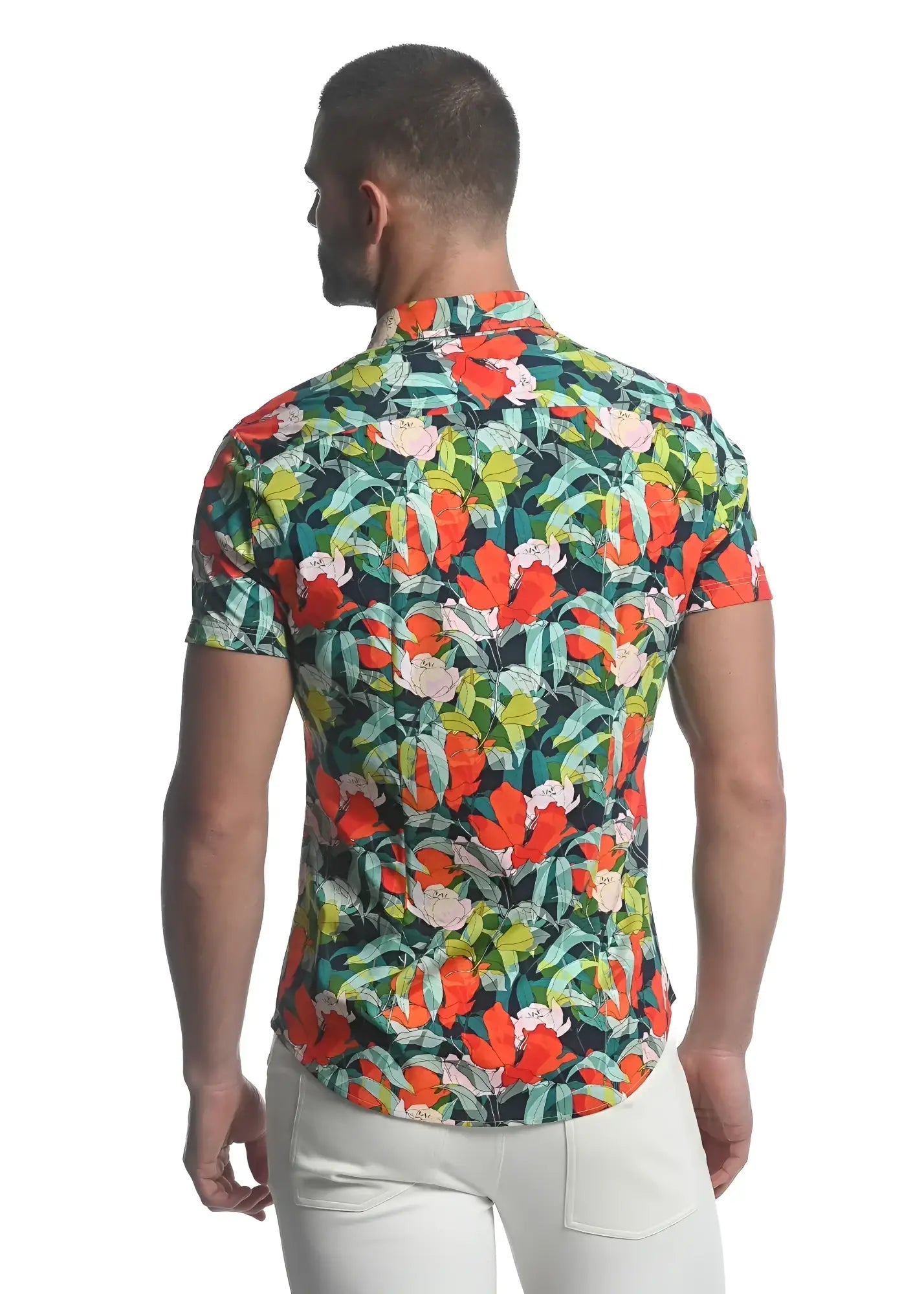 Men’s paradise stretch knit shirt with short sleeves and vibrant red orange pink green tropical floral pattern on dark background