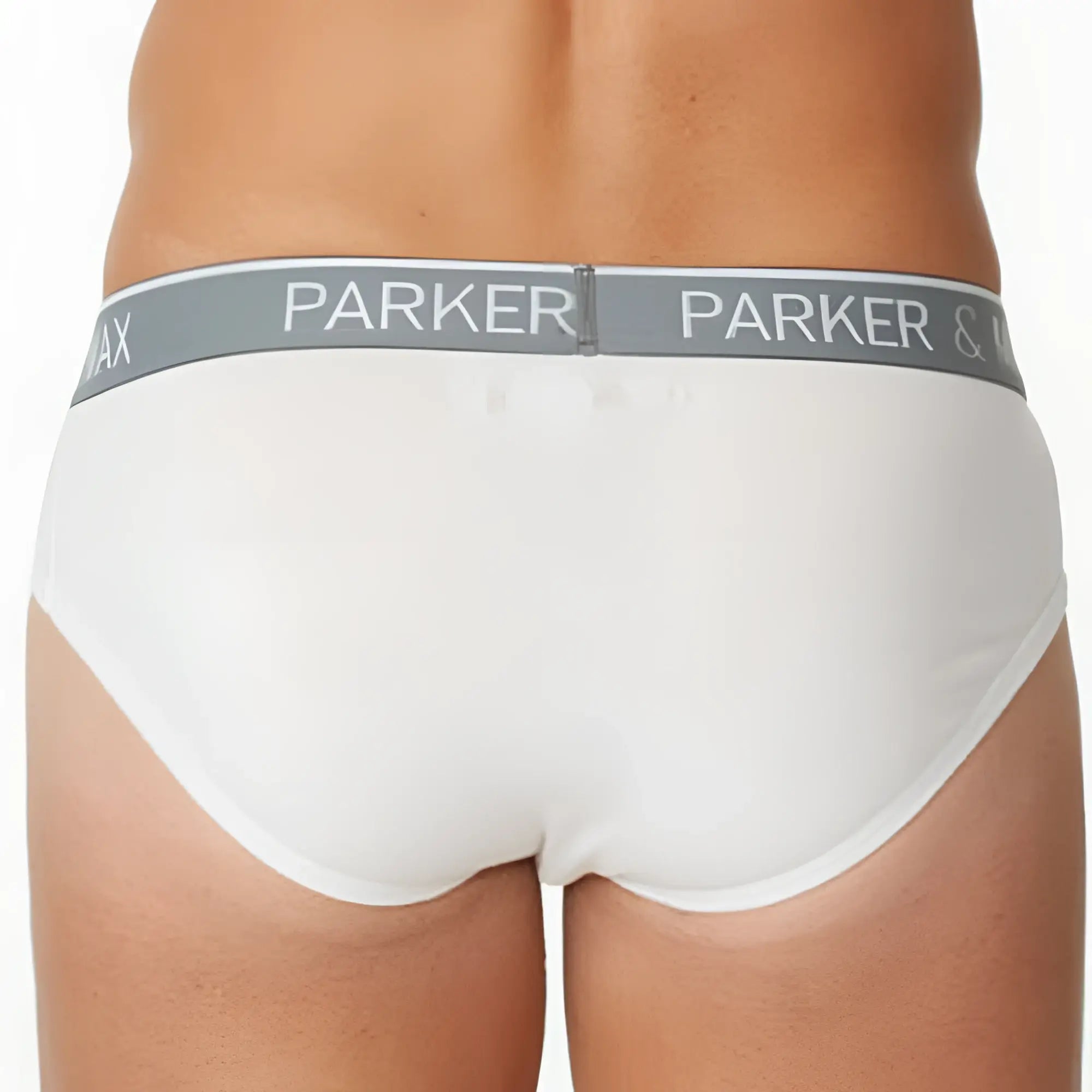 White parker and co brief bag in white leather showing back side with logo and sturdy handle detail