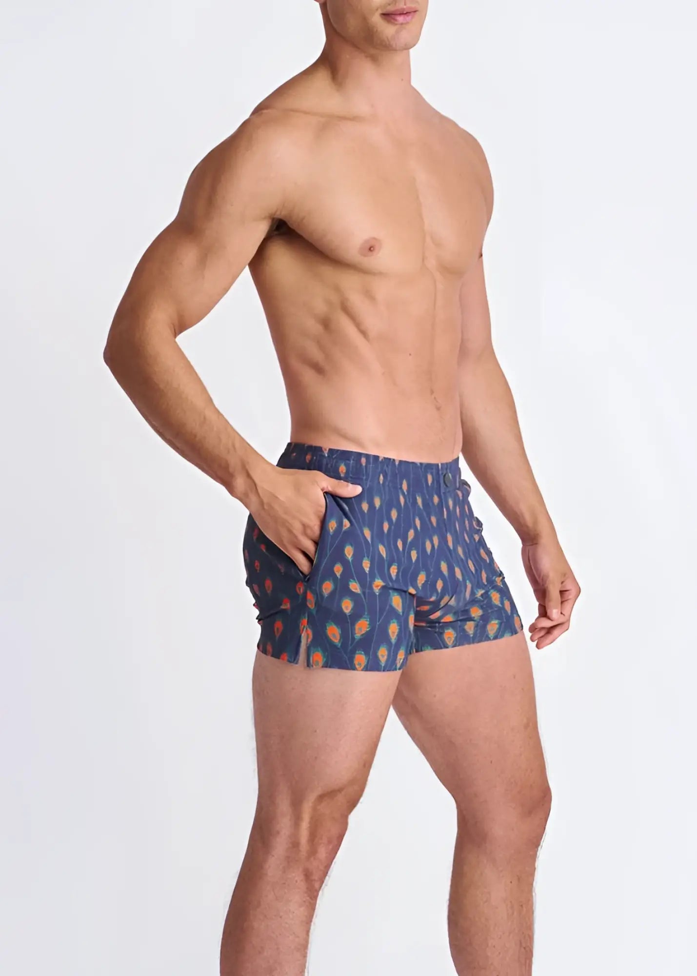Peacock feathers seersucker swim shorts in blue with orange and yellow leaf motifs and mesh lining