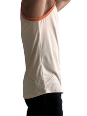 Cream-colored sleeveless tank top with orange ribbed neckline and matching hem stitching in sand beige color