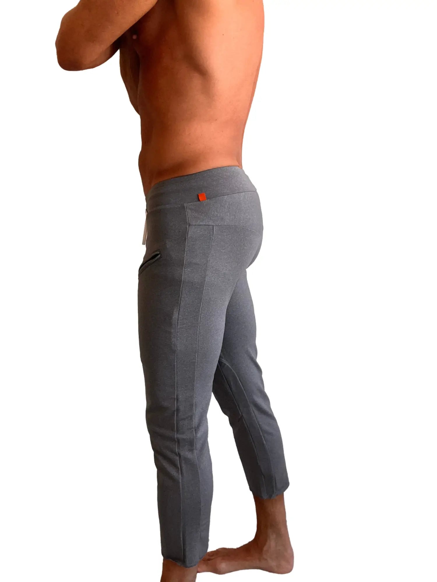 Performance premium mens dark grey heather athletic capri yoga pants with sleek form-fitting design and subtle texture