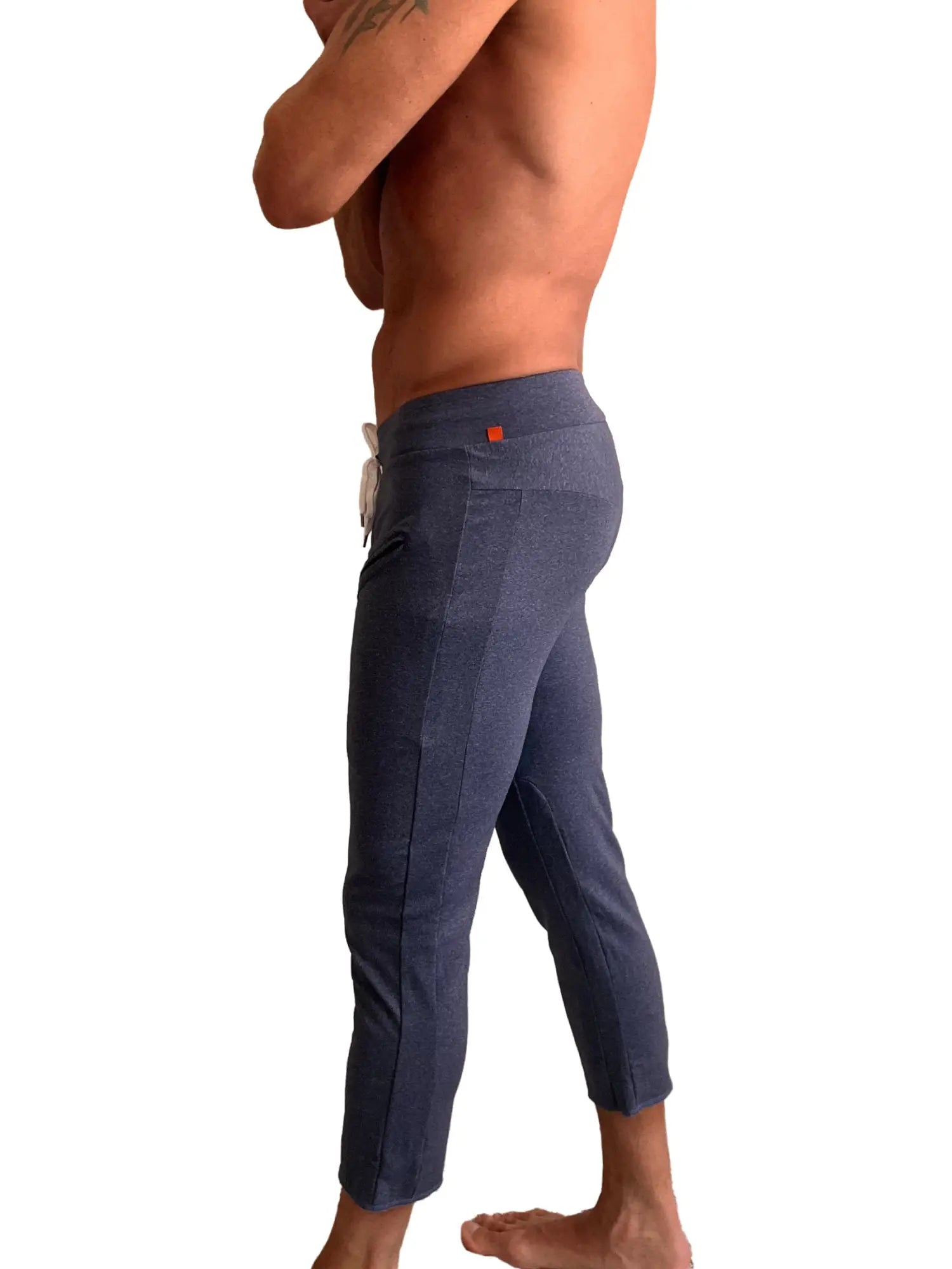 Performance premium mens navy blue heather capri yoga pants with textured fabric white drawstring and orange tag