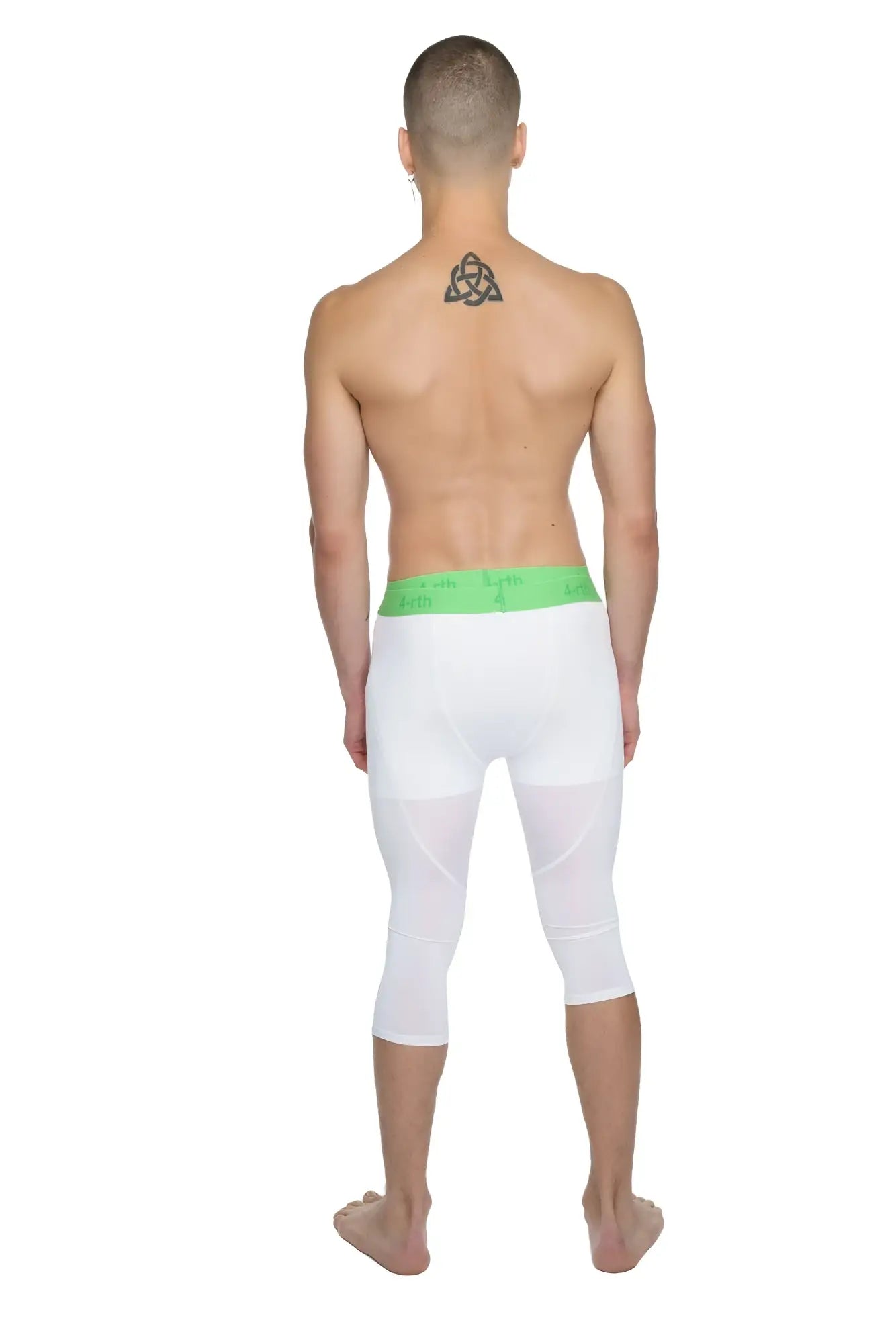 White capri-length performance yoga leggings in arctic white with a bright green elastic waistband for active wear