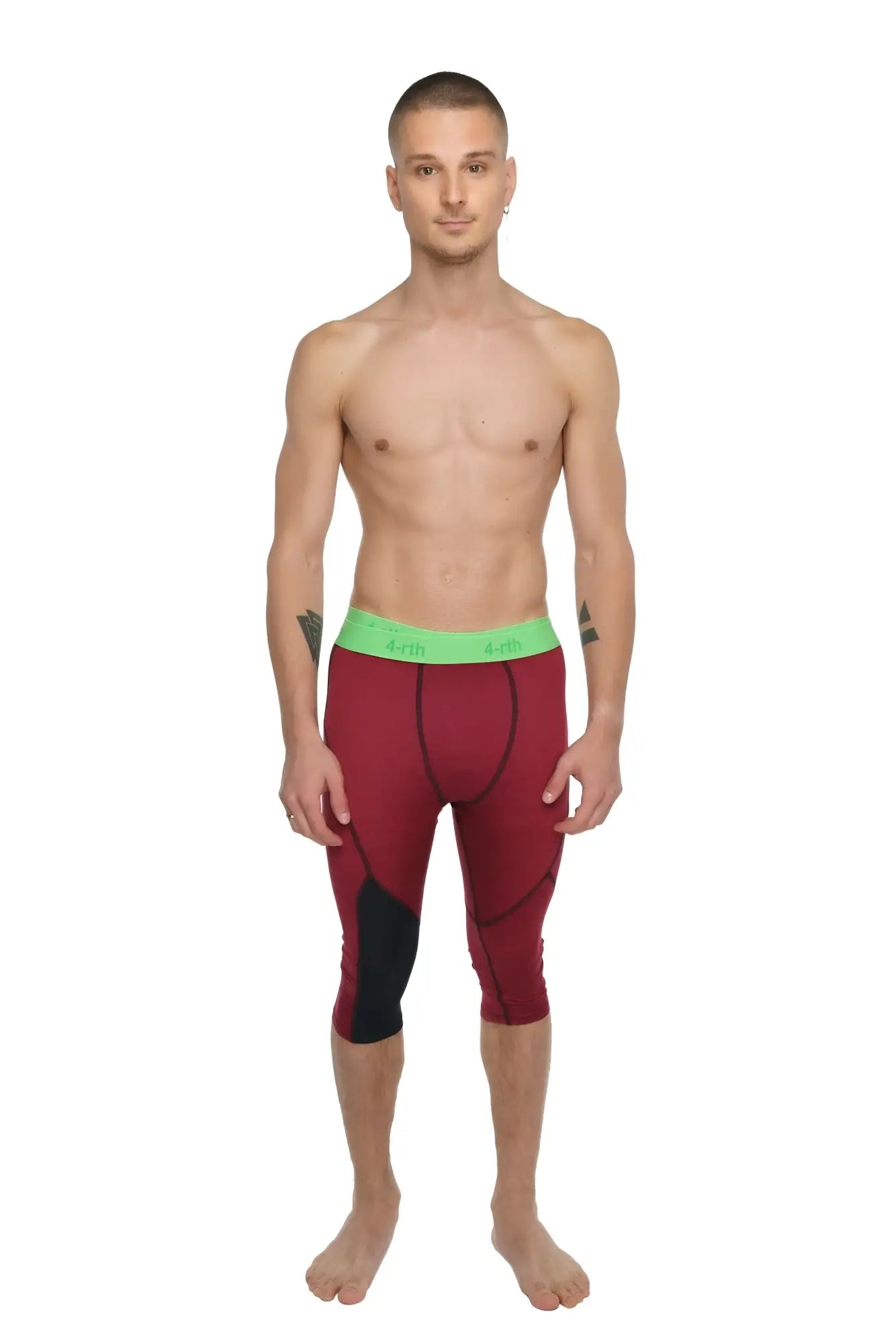 Performance yoga leggings 3/4 in brick red heather with maroon and black fabric and a bright green waistband