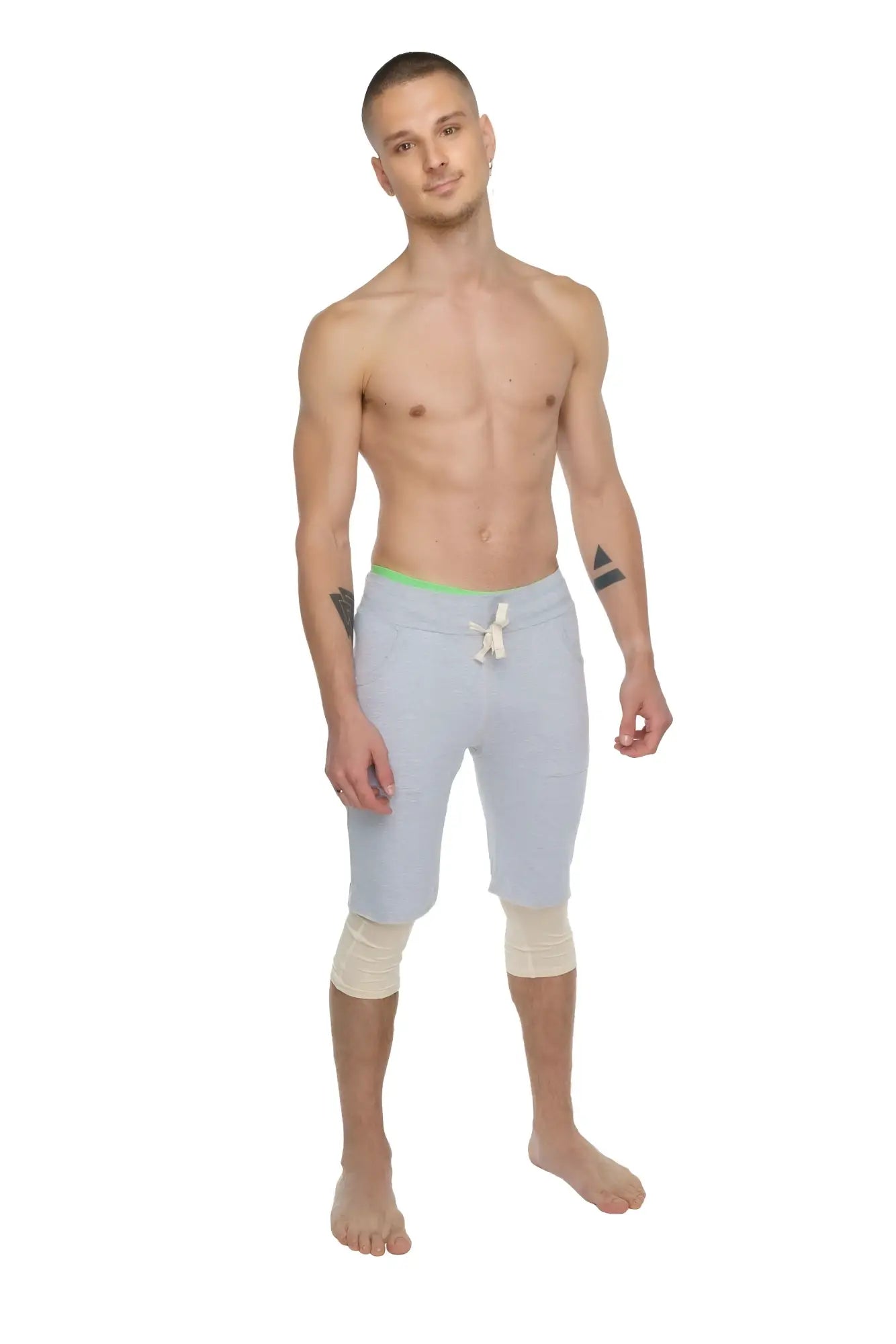 Light gray athletic shorts with neon green waistband and white drawstring designed for performance yoga and exercise