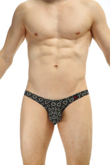 Black thong with white heart pattern from petitq bikini dumbo coeur collection showing front side design