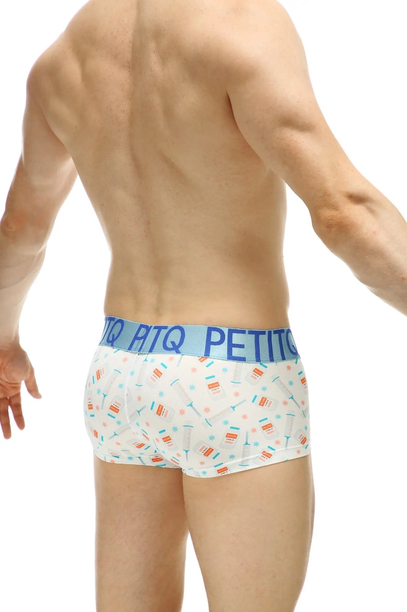 White men’s briefs with colorful candy and sprinkles pattern and light blue petitq waistband from petitq boxer covid vaccine collection