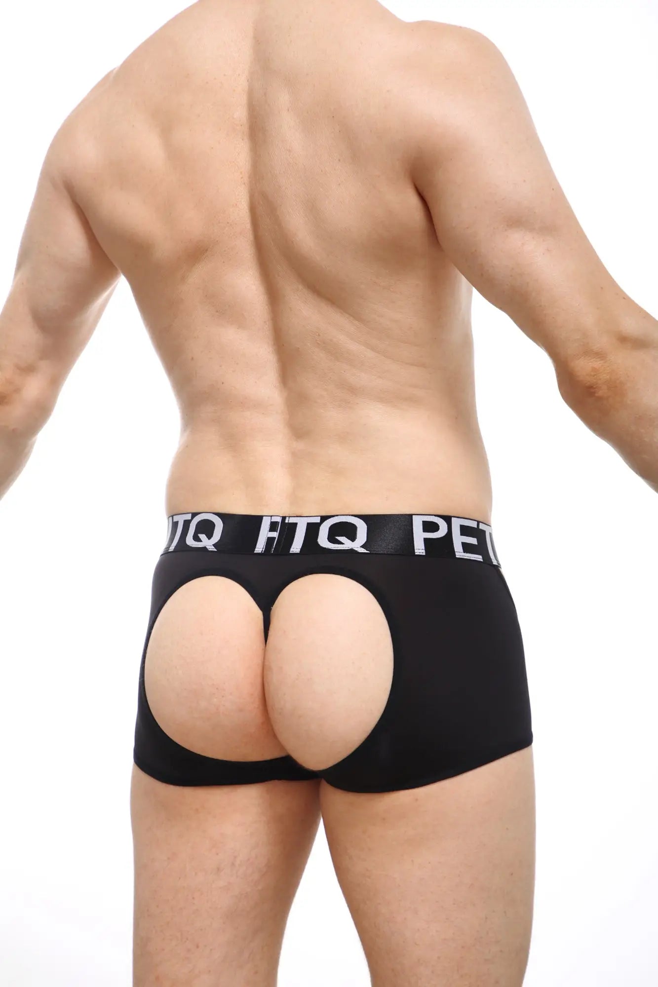 Black petitq boxer string mecrin briefs with buttocks cutout and elastic waistband with white lettering back view
