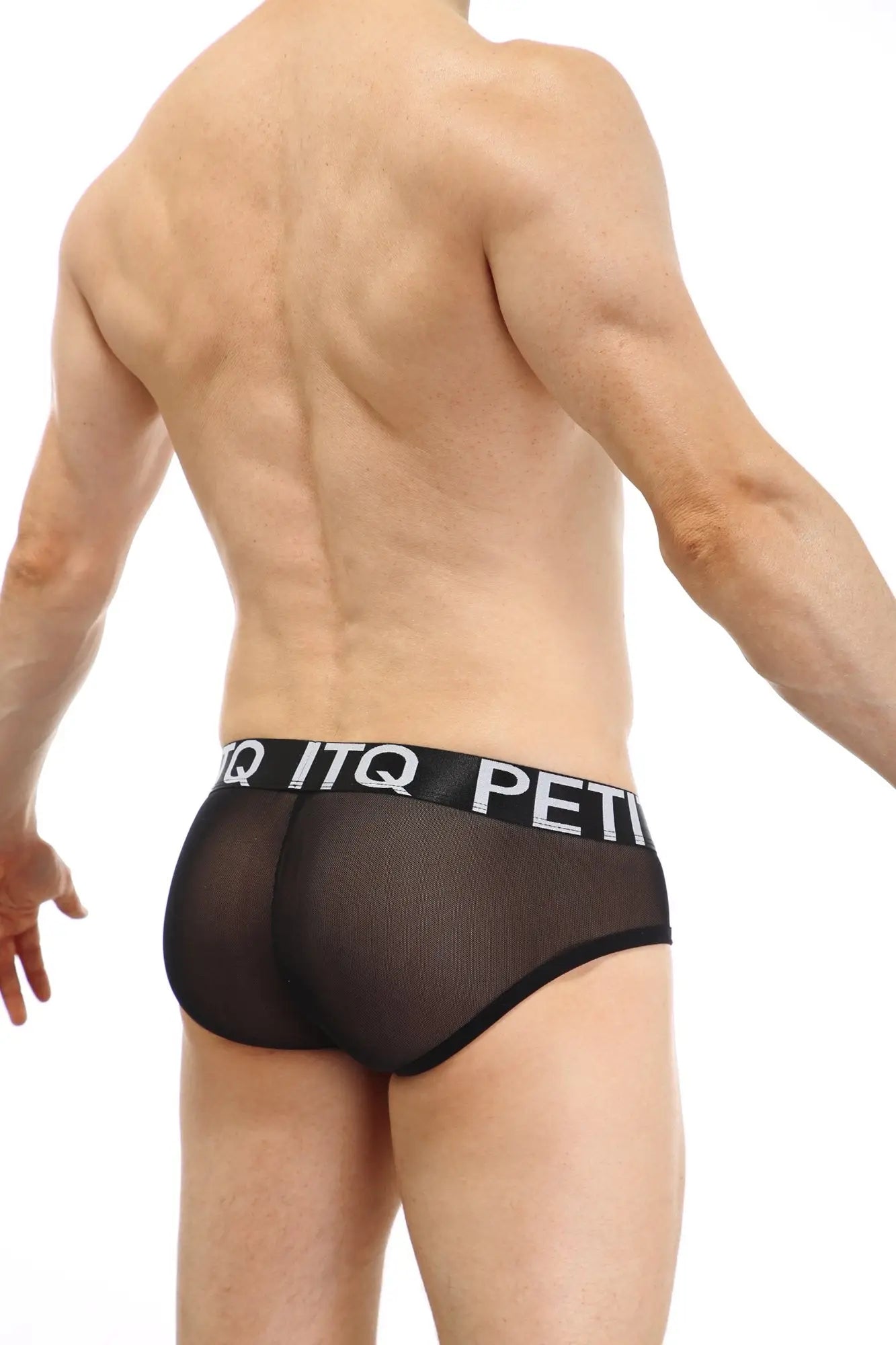 Black sheer mesh briefs with a black elastic waistband featuring white petitq lettering from the petitq brief double pouch sitges collection