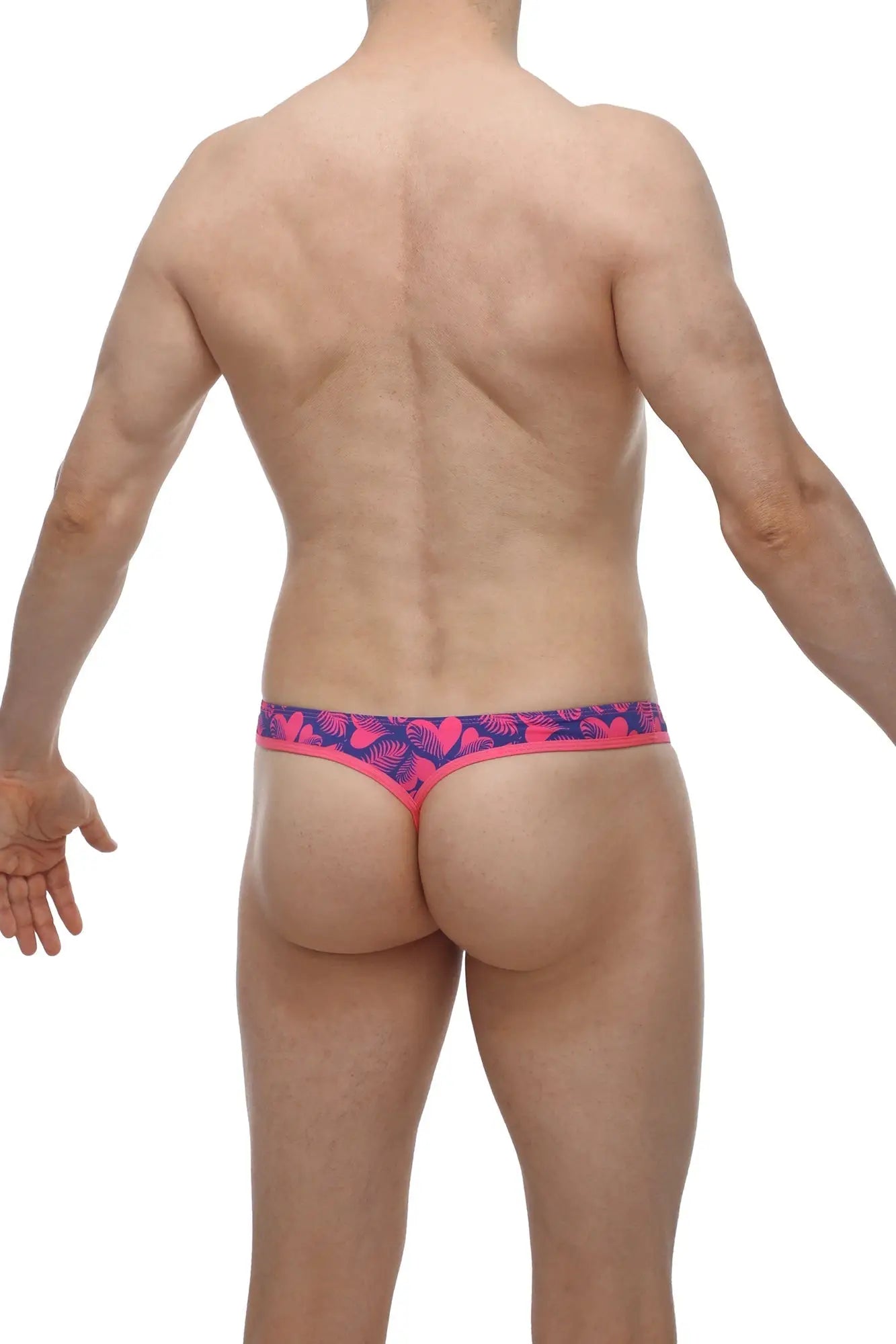 Bright pink and navy blue petitq g-string with tropical leaf pattern thong showing front side design