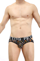 Black petitq jockstrap lunan sitges with playful cartoon mushroom banana and orange slice pattern briefs