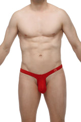 Red thong by petitq made of smooth stretchy fabric with a small logo on the waistband showing the back side