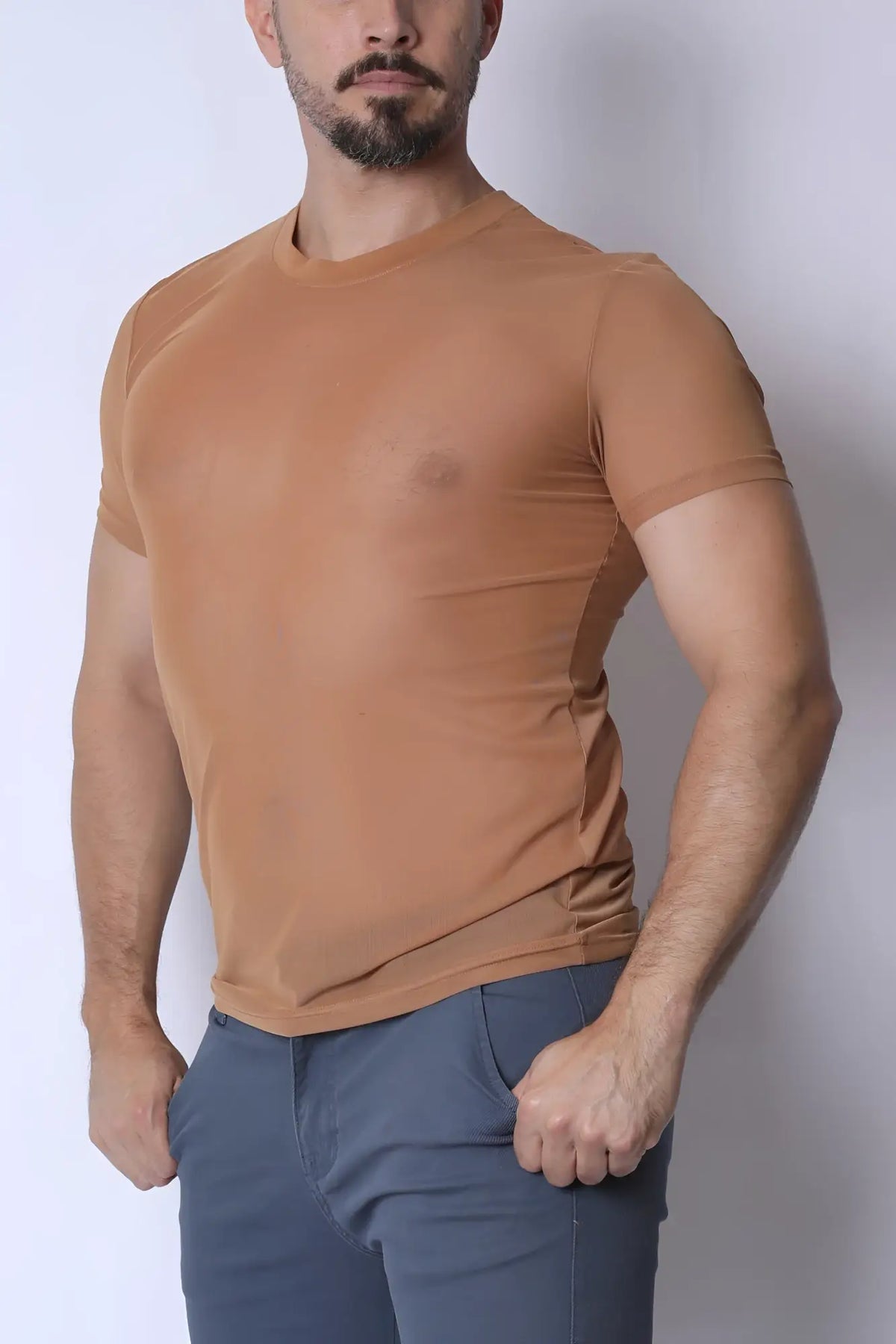 Tan form-fitting phantom mesh t-shirt with short sleeves and crew neck made from breathable fabric