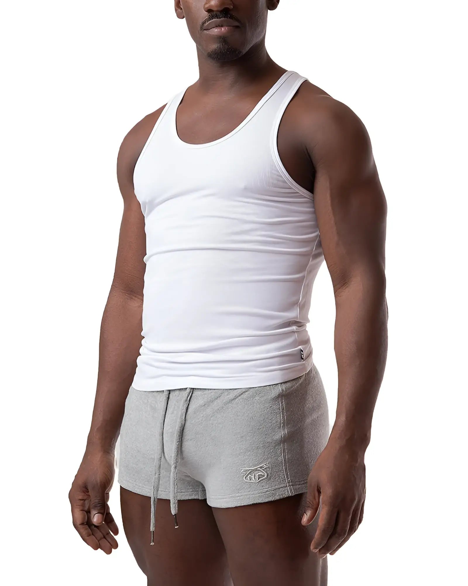 White ribbed cotton pig rib tank top with classic scoop neckline and snug fit for casual wear
