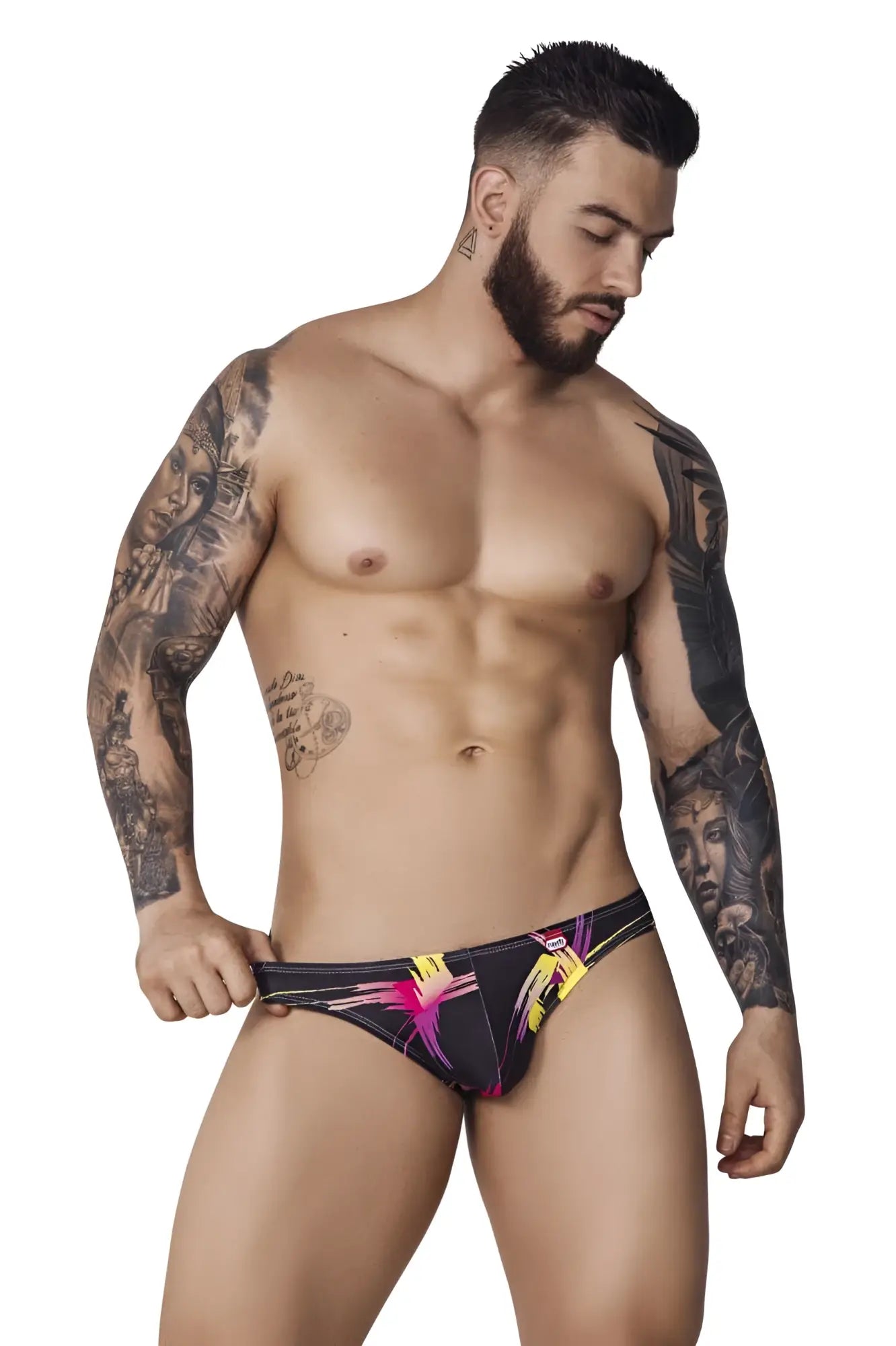 Black pikante pik 1076 nucleus jockstrap with vibrant pink and yellow abstract designs on swim trunks material